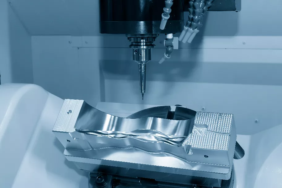 The hi-precision 5-axis machining center cutting a product - rapid prototyping
